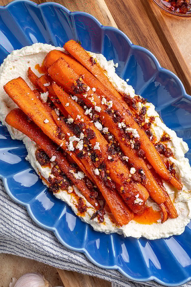 Spicy Smoked Carrots Over Roasted Garlic Whipped Feta Plated